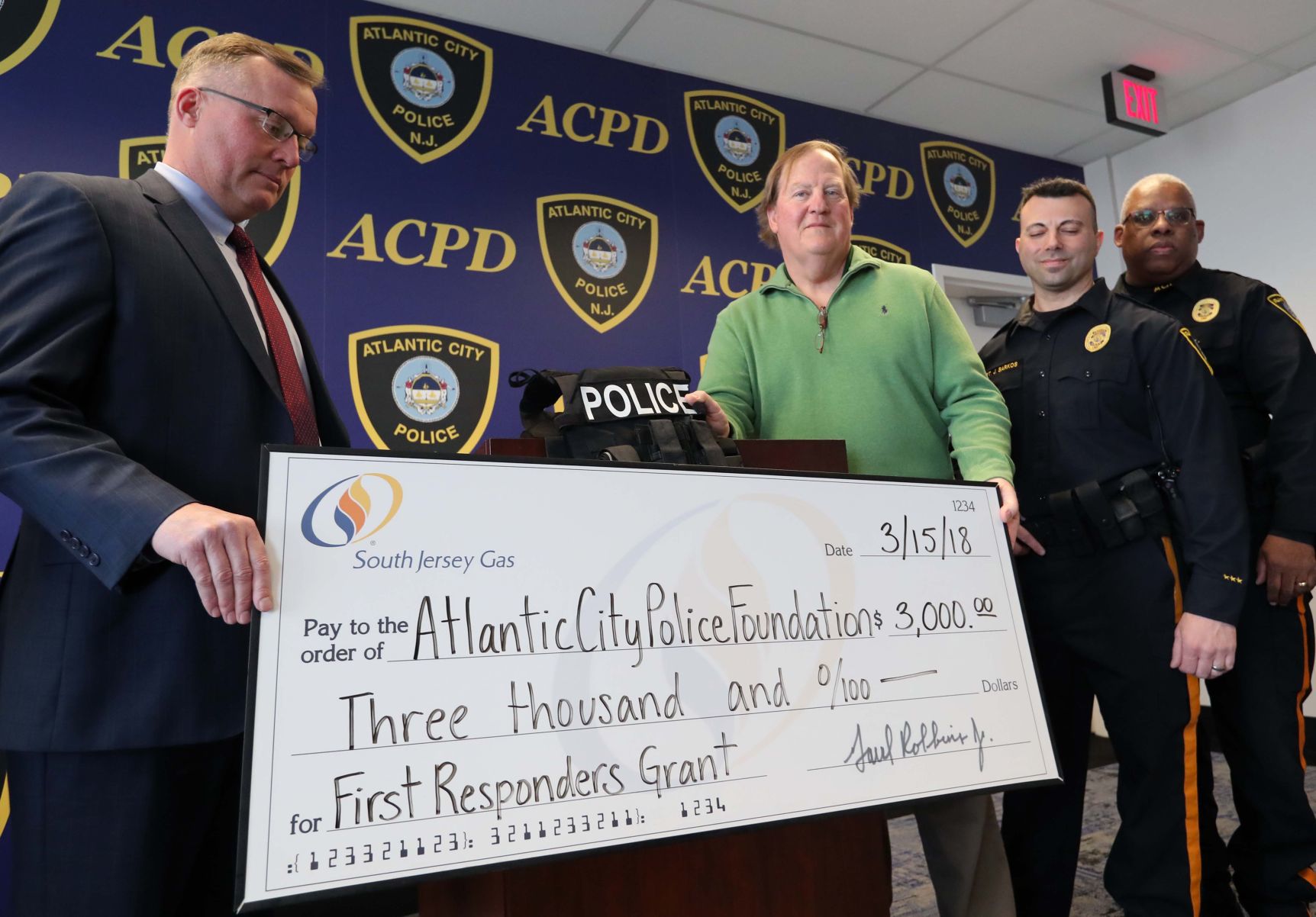 Atlantic City Police Foundation receives a check from SJ Gas